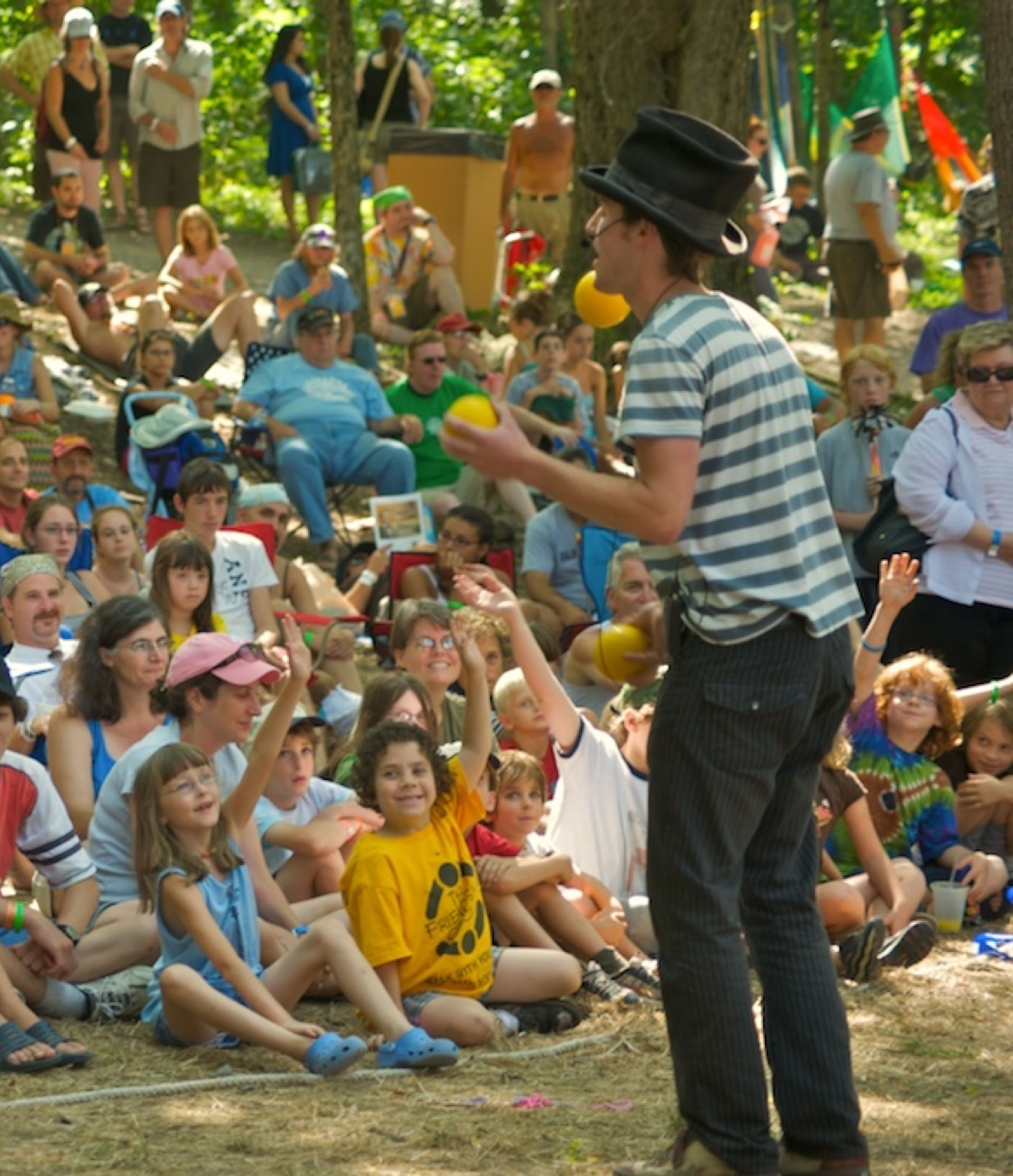 ball juggler playing with audience at a festival