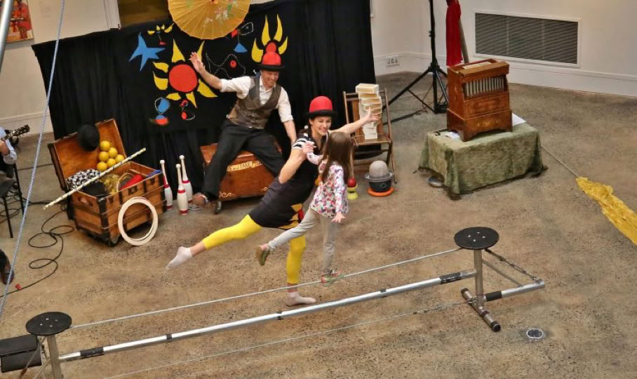 volunteer child walking across a small tight wire
