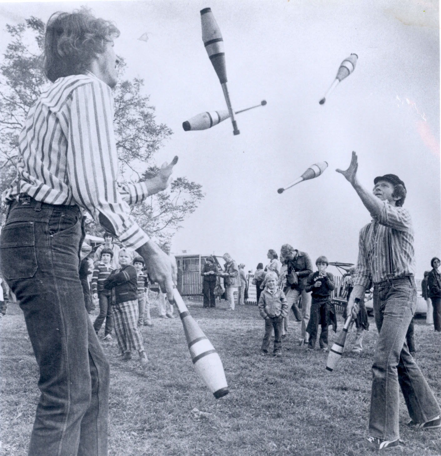 passing juggling clubs b&w